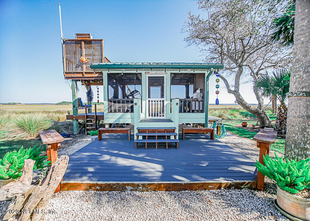 12625 Sawpit Road Jacksonville, FL 32226 - Photo 38 of 63 a front view of a house with garden