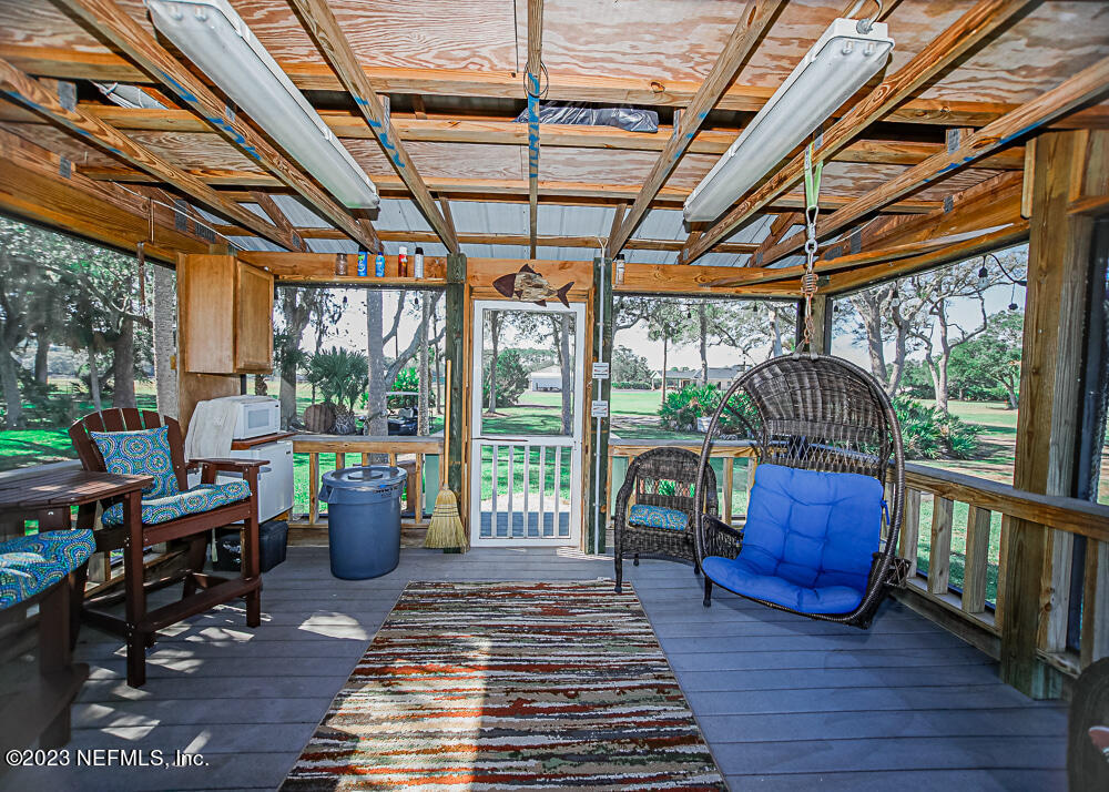 12625 Sawpit Road Jacksonville, FL 32226 - Photo 42 of 63 a living room with furniture a wooden floor and a window