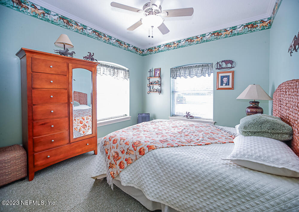 12625 Sawpit Road Jacksonville, FL 32226 - Photo 49 of 63 a bedroom with a bed and a dresser