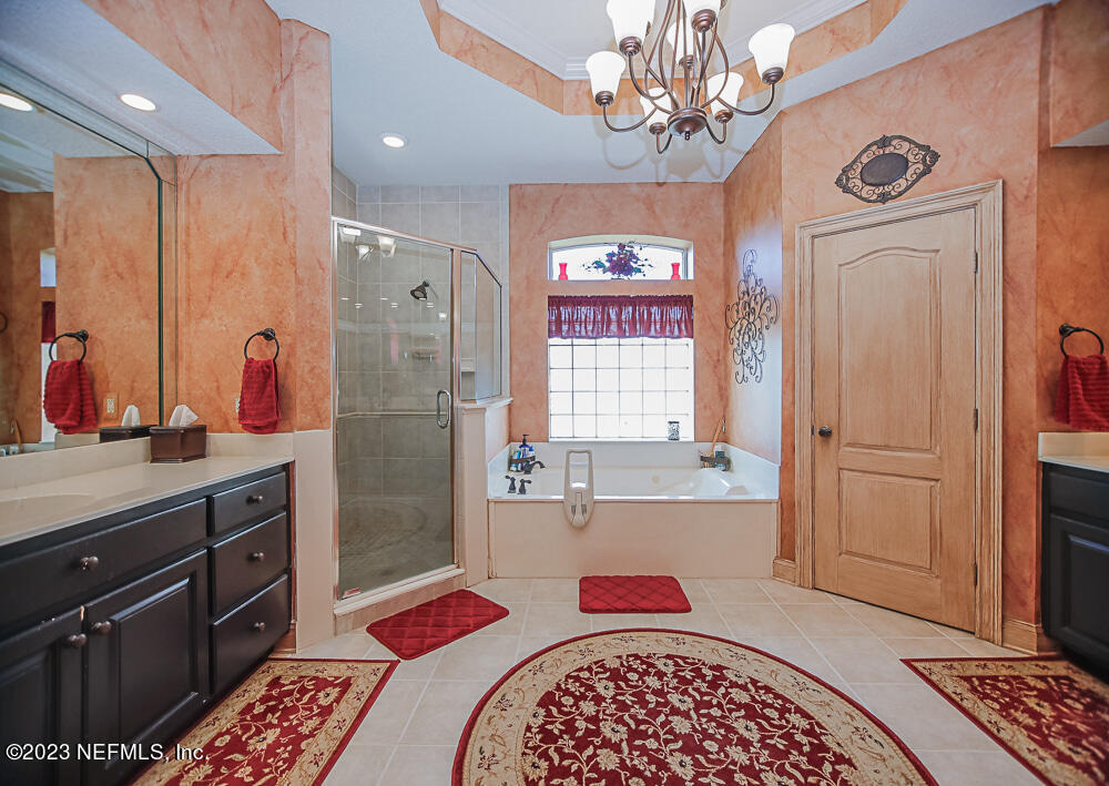 12625 Sawpit Road Jacksonville, FL 32226 - Photo 58 of 63 a bathroom with a sink a vanity and a mirror