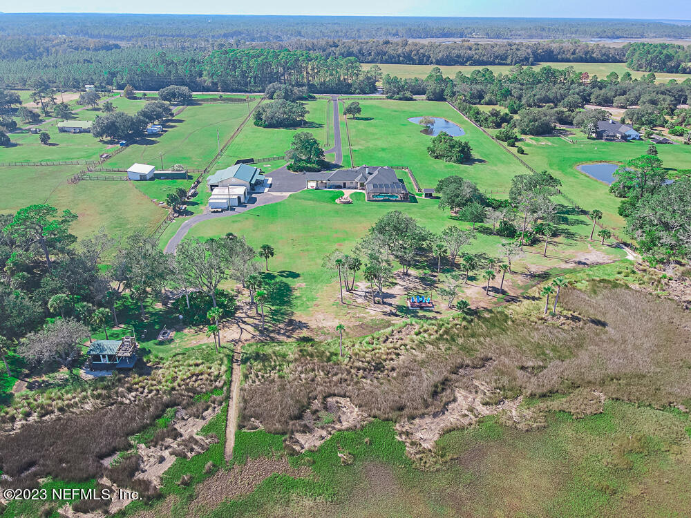 12625 Sawpit Road Jacksonville, FL 32226 - Photo 8 of 63 a view of a grassy field with trees