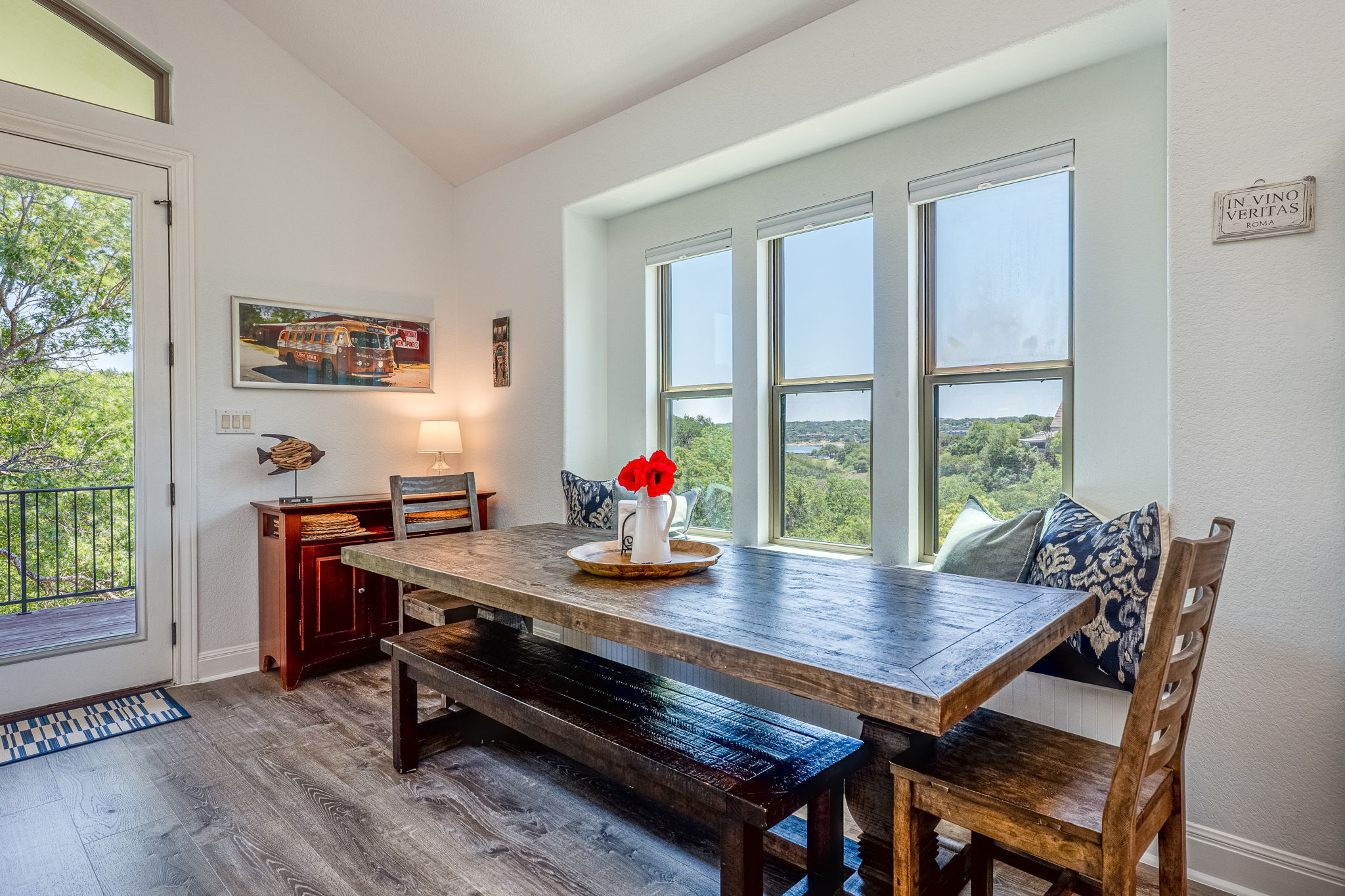 433 Venture Boulevard South Point Venture, TX 78645 - Photo 5 of 36 Treetop views and a peek of Lake Travis make this dining nook anything but ordinary.
