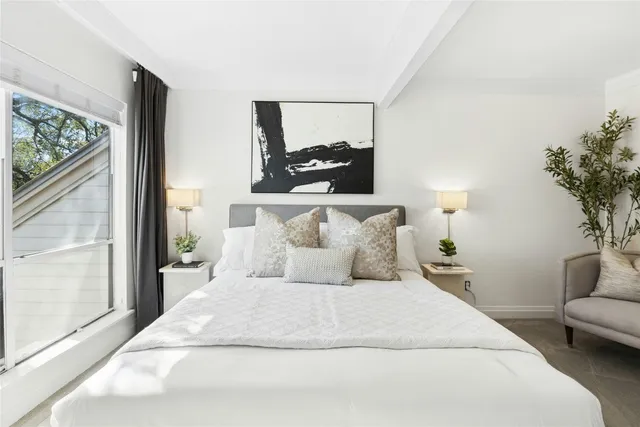 a bedroom with a large bed and a couch