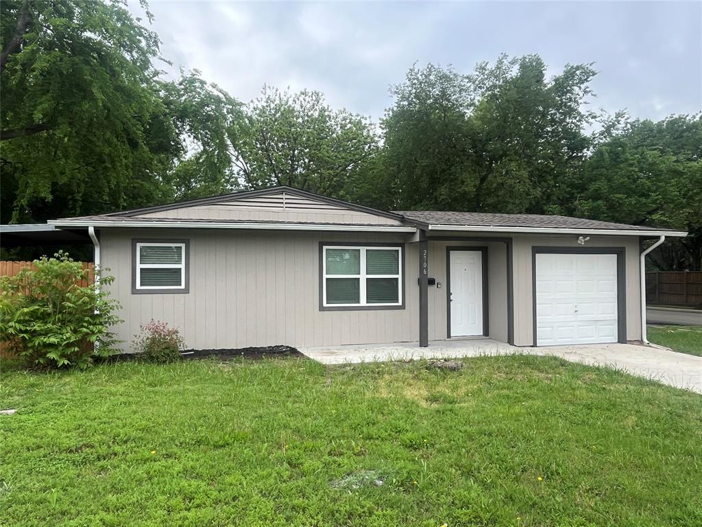 2706 Gross Road Dallas, TX 75228 - Photo 2 of 23 The property features a single-story exterior with light-colored siding and dark trim, a white front door, and a white garage door