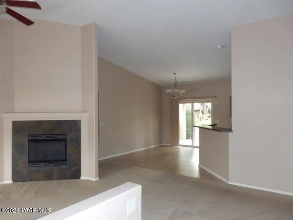 a view of a hallway with an empty room