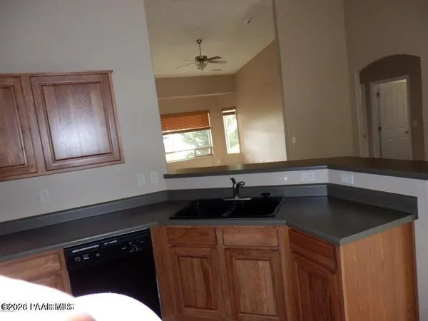 a kitchen with a sink and a window