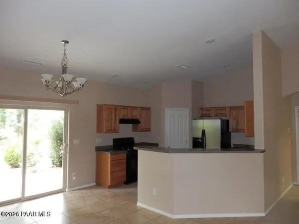 a kitchen with stainless steel appliances granite countertop a stove and a refrigerator