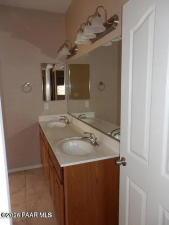a bathroom with a sink and mirror