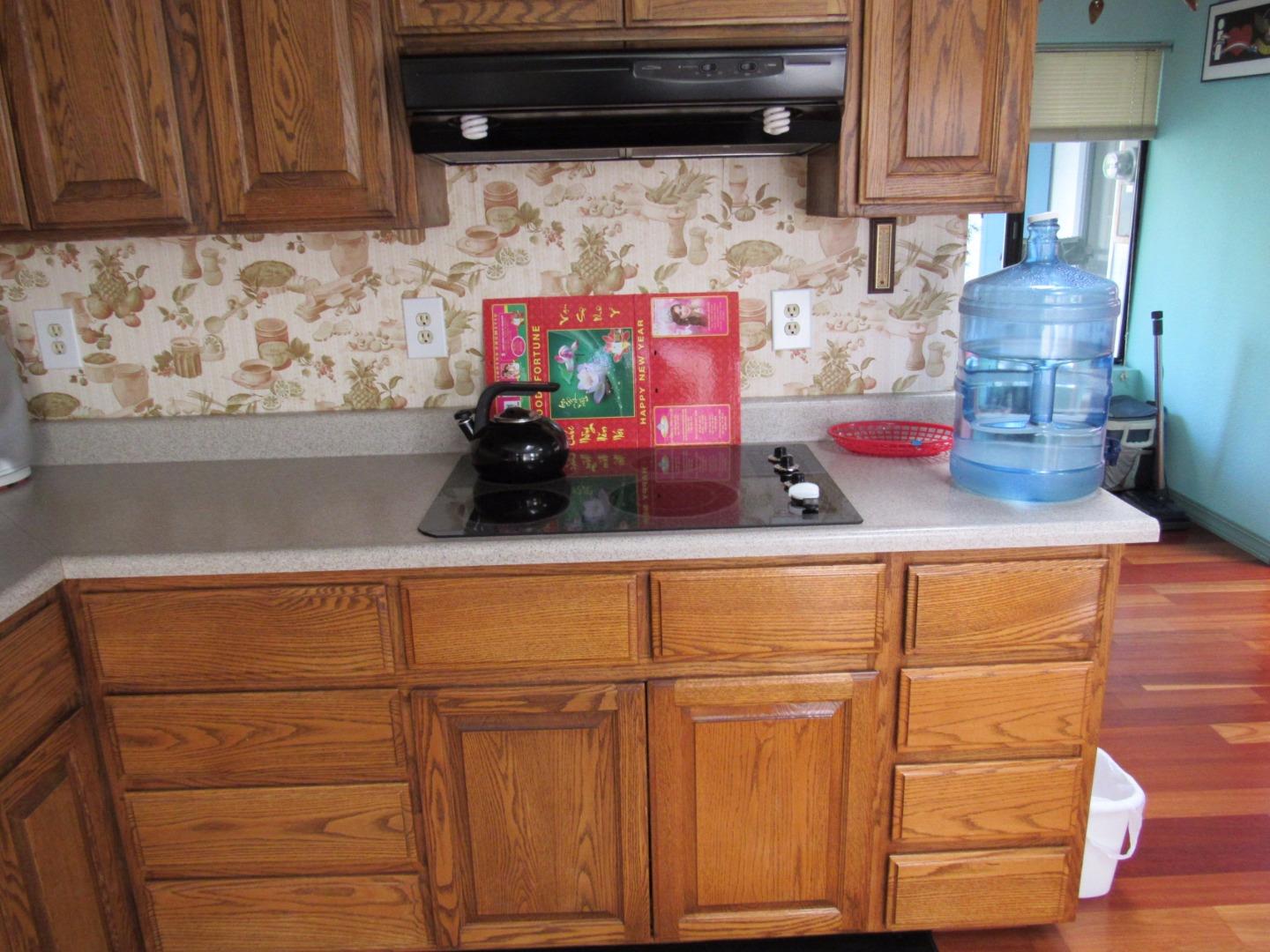 349 Doris Avenue San Jose, CA 95127 - Photo 22 of 23 a kitchen with a cabinets and wooden floor