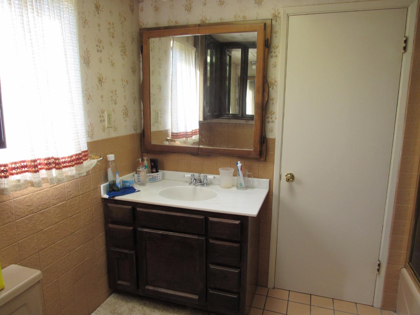 349 Doris Avenue San Jose, CA 95127 - Photo 7 of 23 a bathroom with a sink and a mirror