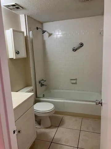 a bathroom with a sink a toilet and a bathtub