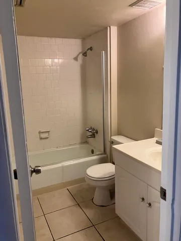 a bathroom with a bathtub toilet and sink