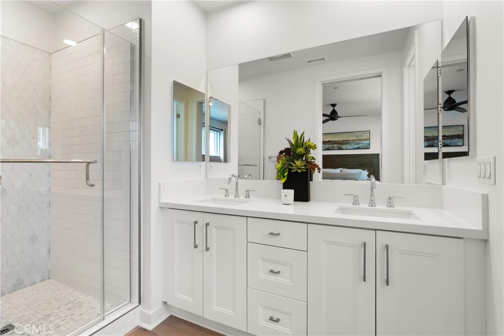 3321 Doheny Way Dana Point, CA 92629 - Photo 20 of 48 a bathroom with a double vanity sink mirror and shower