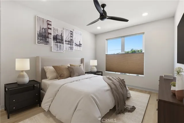 a bedroom with a bed and a lamp