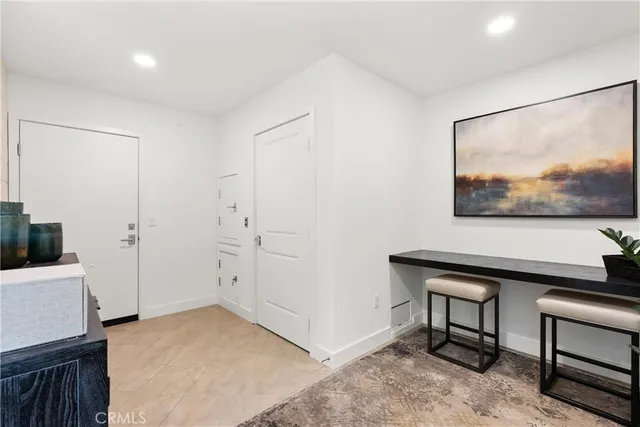 a view of a livingroom with furniture and cabinet