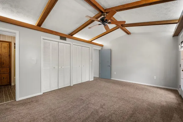 a view of a room with a hanging light