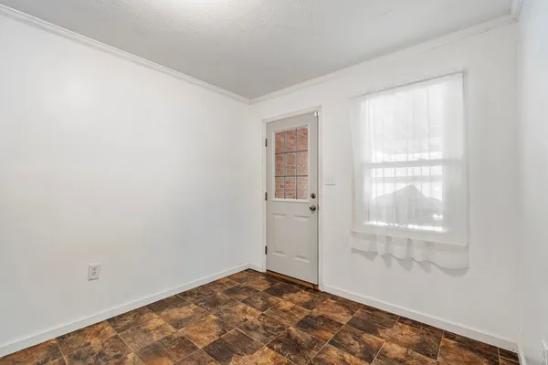 a view of an empty room and window