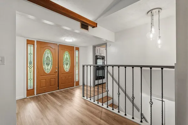 a view of entryway with wooden floor