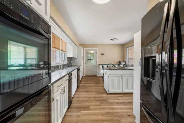 a kitchen with counter top space and stainless steel appliances