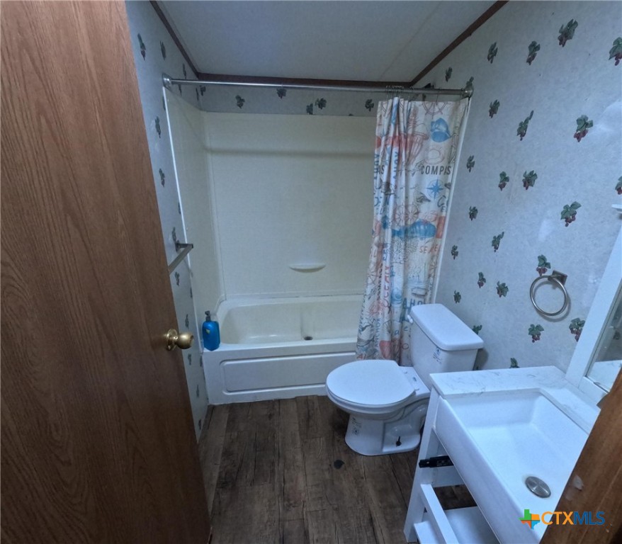 590 Lee Street Victoria, TX 77905 - Photo 11 of 41 a bathroom with a sink toilet and shower