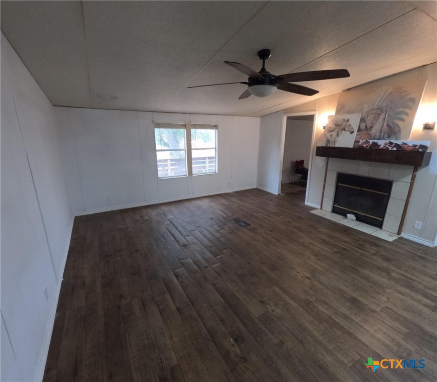 590 Lee Street Victoria, TX 77905 - Photo 18 of 41 a view of an empty room with a fireplace and a window