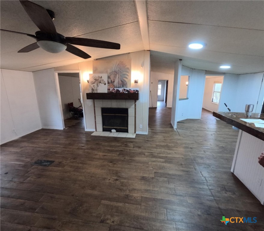 590 Lee Street Victoria, TX 77905 - Photo 19 of 41 a view of an empty room with wooden floor and a fireplace