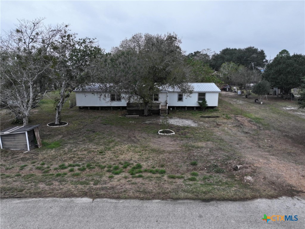590 Lee Street Victoria, TX 77905 - Photo 2 of 41 a backyard of a house with a parked car