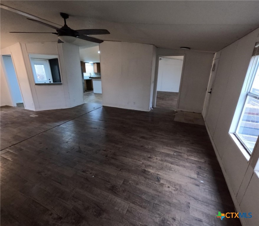 590 Lee Street Victoria, TX 77905 - Photo 26 of 41 en empty room with windows and ceiling fan