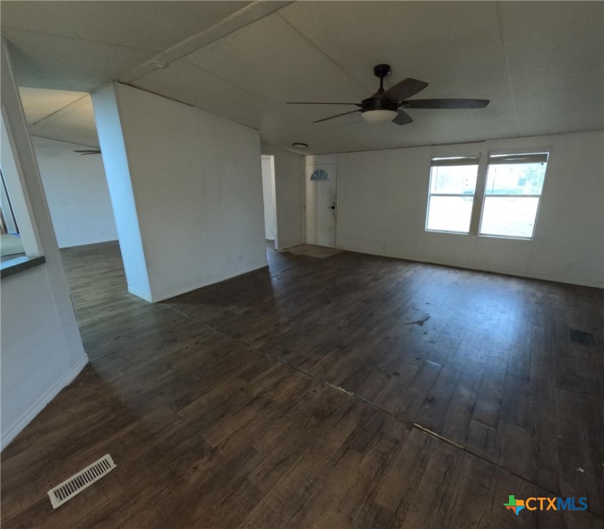 590 Lee Street Victoria, TX 77905 - Photo 27 of 41 an empty room with wooden floor and a ceiling fan