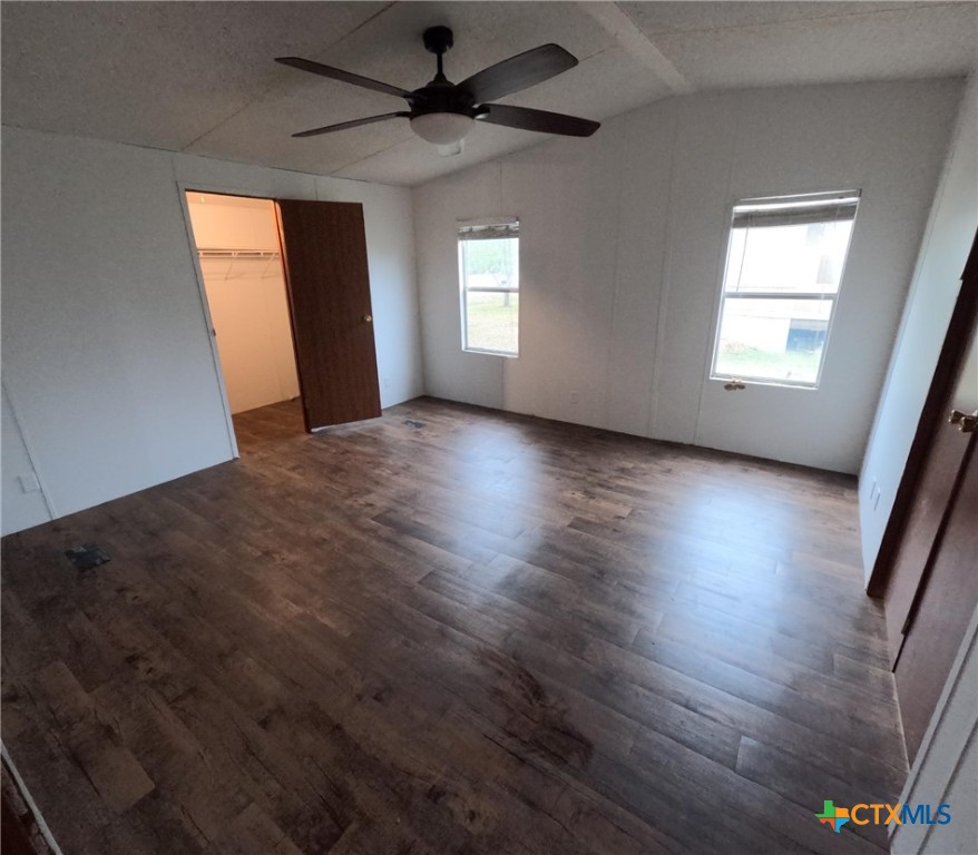 590 Lee Street Victoria, TX 77905 - Photo 32 of 41 an empty room with wooden floor and windows
