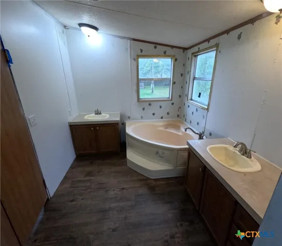 a view of stairs and wooden floor