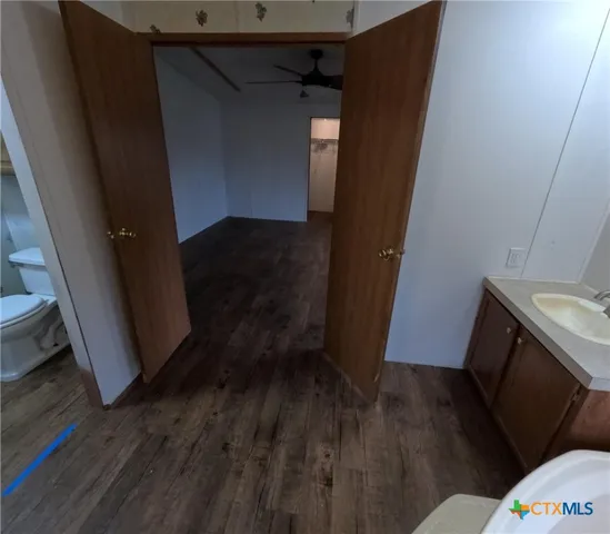 a kitchen with stainless steel appliances granite countertop a refrigerator a sink and a stove