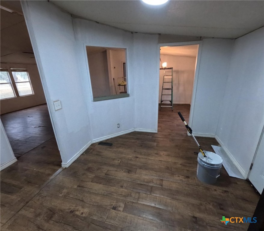 590 Lee Street Victoria, TX 77905 - Photo 40 of 41 an empty room with wooden floor and windows