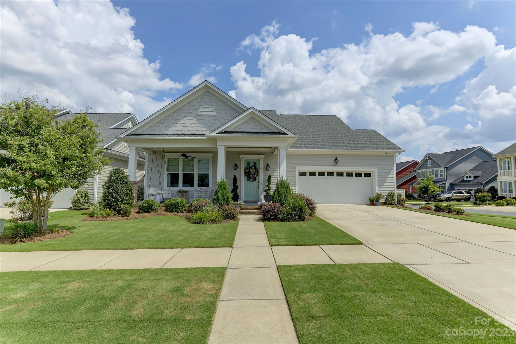a front view of house with yard and green space