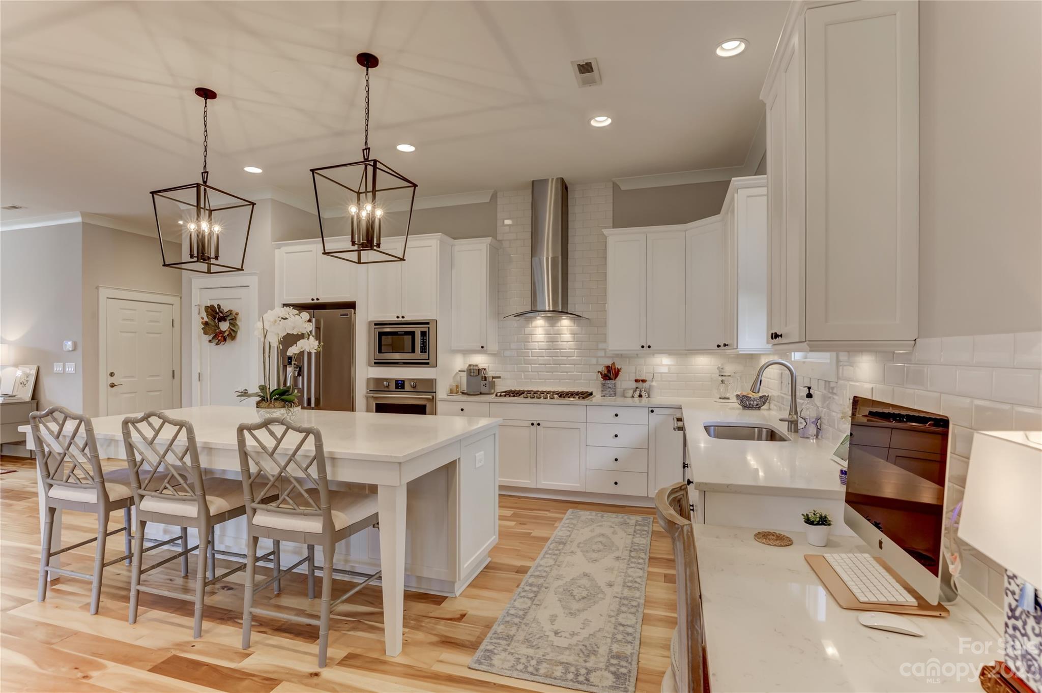 151 Inspired Way Fort Mill, SC 29708 - Photo 14 of 48 a large kitchen with lots of counter space and stainless steel appliances