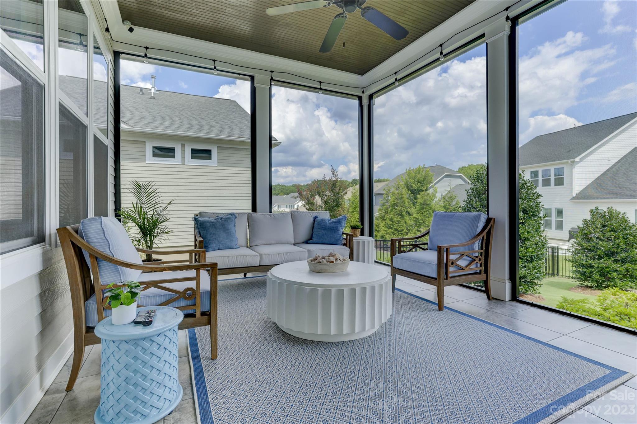151 Inspired Way Fort Mill, SC 29708 - Photo 20 of 48 a living room with furniture and a floor to ceiling window