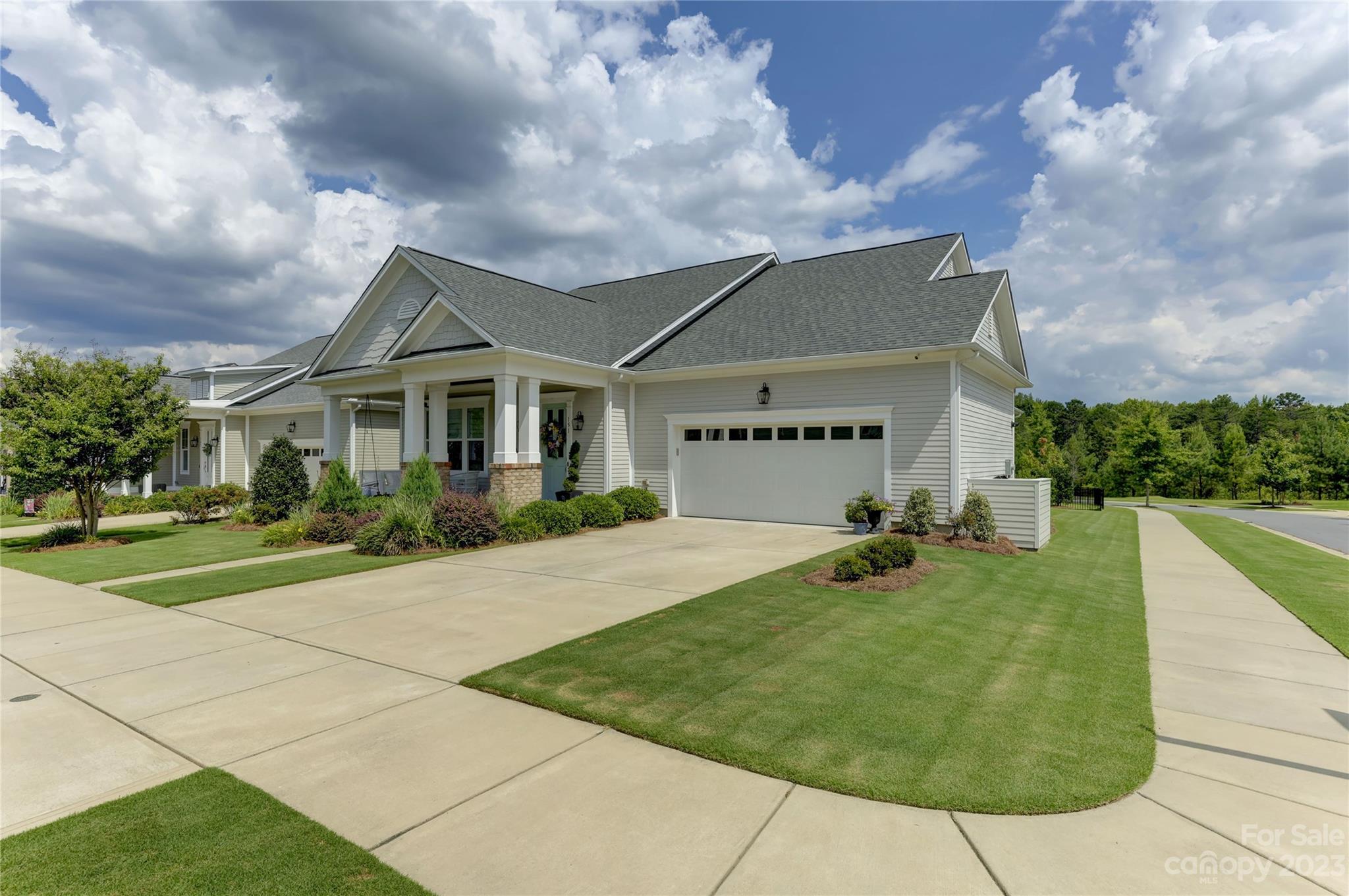 151 Inspired Way Fort Mill, SC 29708 - Photo 2 of 48 a front view of a house with garden