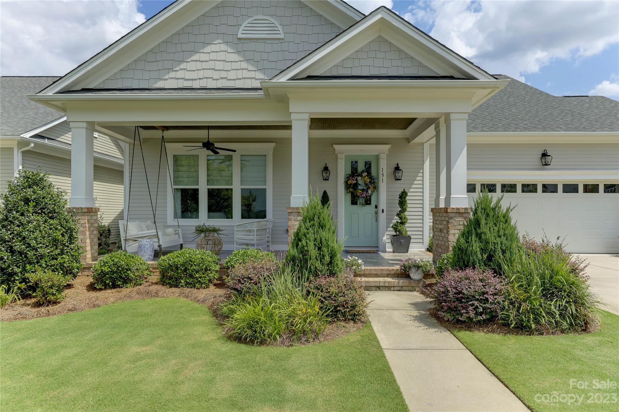 151 Inspired Way Fort Mill, SC 29708 - Photo 3 of 48 a front view of a house with garden