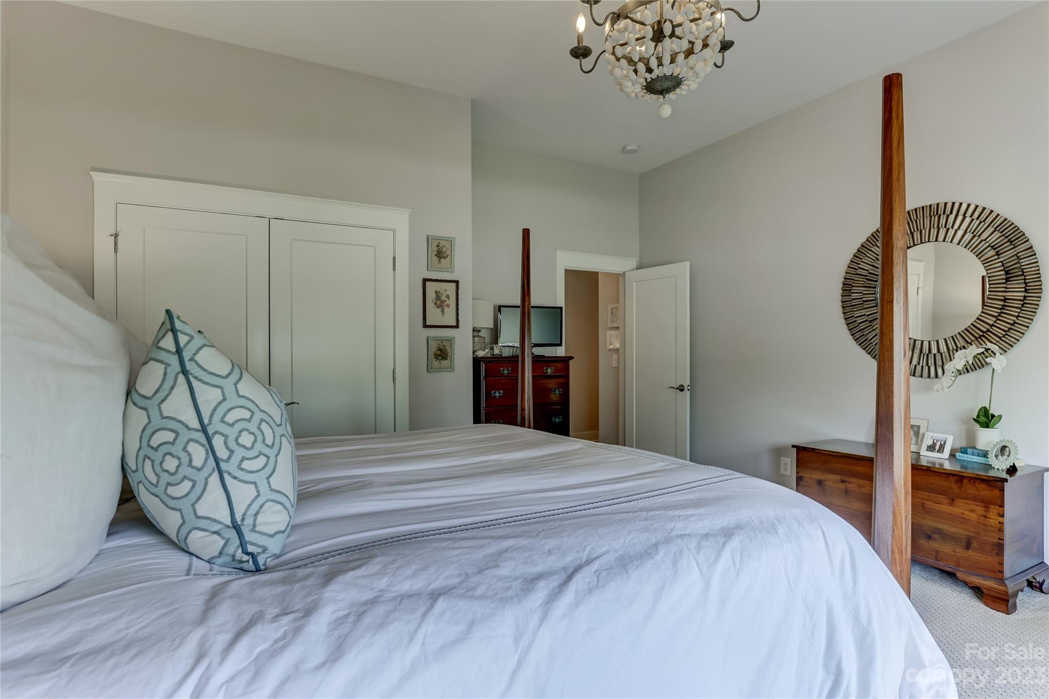 151 Inspired Way Fort Mill, SC 29708 - Photo 33 of 48 a bedroom with a bed and a chandelier