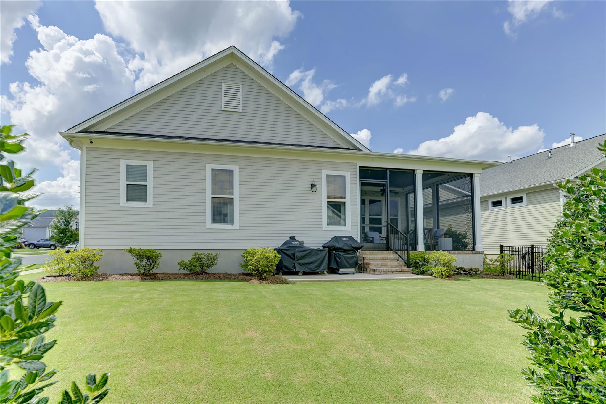 151 Inspired Way Fort Mill, SC 29708 - Photo 46 of 48 a front view of a house with sitting area and garden