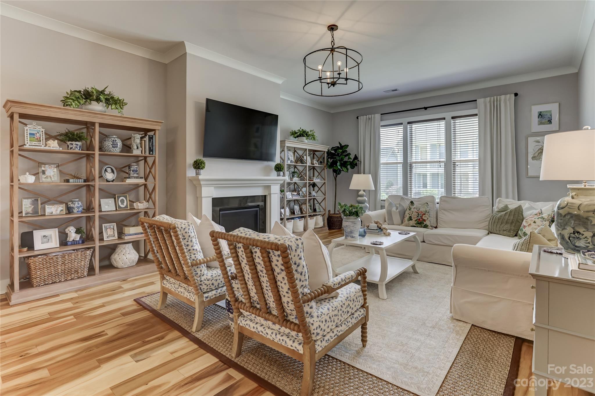 151 Inspired Way Fort Mill, SC 29708 - Photo 8 of 48 a living room with furniture a flat screen tv and a fireplace