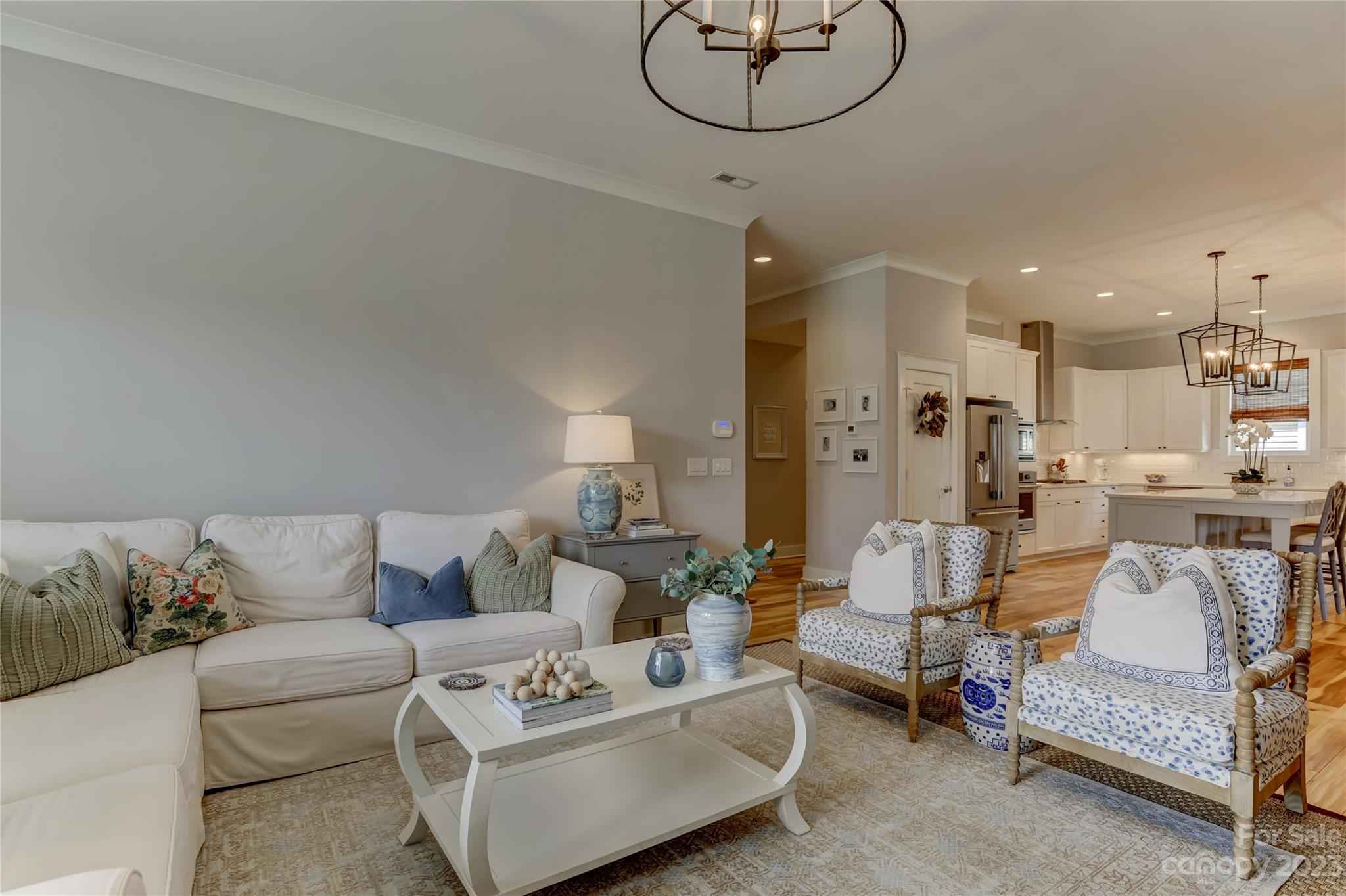 151 Inspired Way Fort Mill, SC 29708 - Photo 10 of 48 a living room with furniture kitchen view and a chandelier