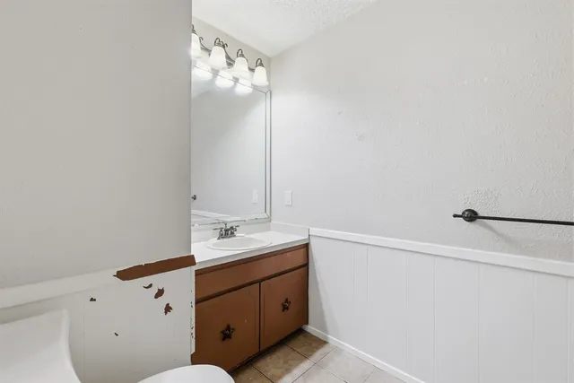 a bathroom with a sink and mirror