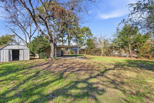 front view of a house with a trees