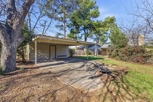 a view of house with swimming pool and outdoor space