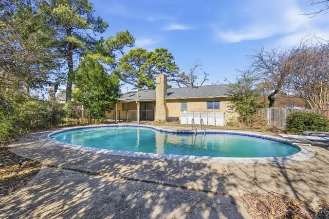 a view of a house with swimming pool