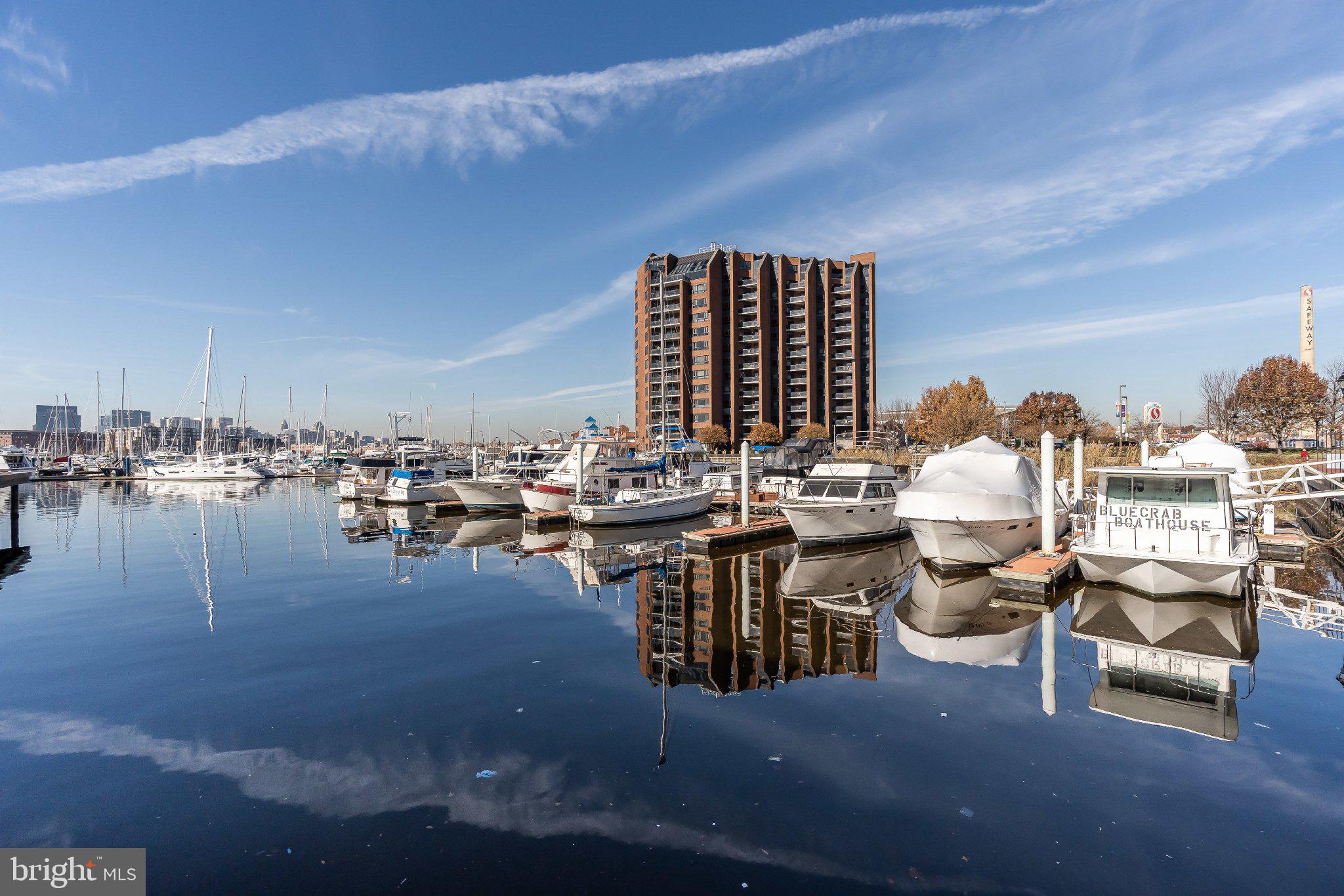 2702 Lighthouse Point East, Unit 532 Baltimore, MD 21224 - Photo 39 of 41 Serene marina reflections at dawn.