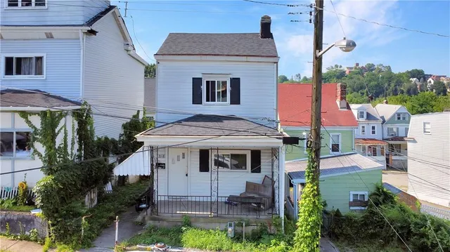 a aerial view of a house with a yard
