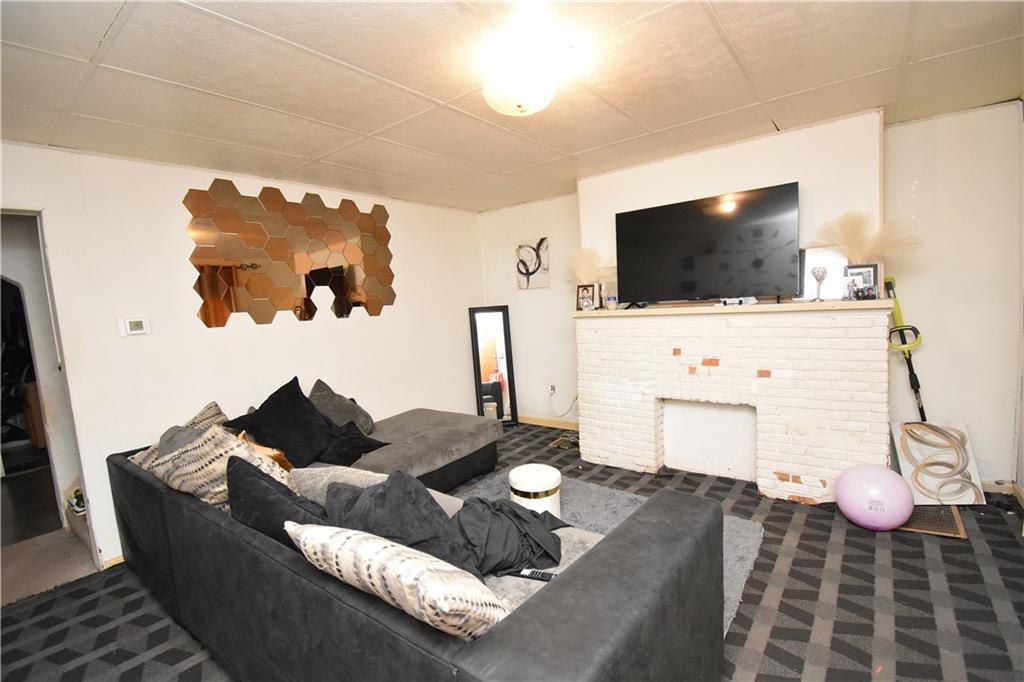 2118 Elsie Street Pittsburgh, PA 15210 - Photo 5 of 12 a living room with furniture and a flat screen tv