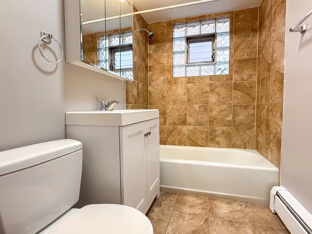 a bathroom with a toilet and a bathtub